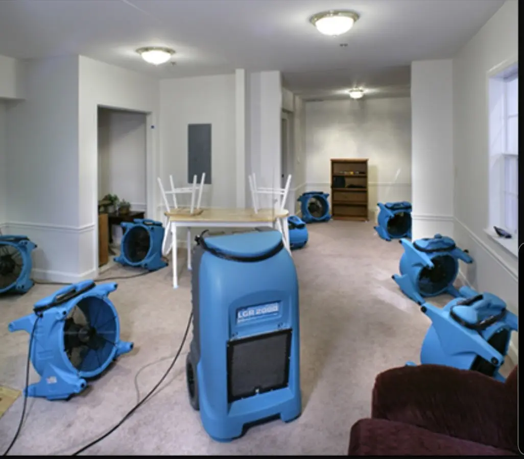 Air movers and dehumidifier setup for Water Damage Restoration in Manchester